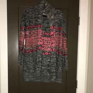 Open pink and black sweater